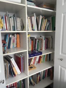 A bookshelf with many books on it